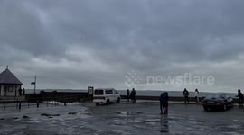 Huge waves from Storm Eunice crash over the sea wall at Llanfairfechan, North Wales