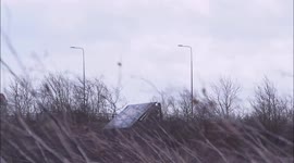 Lorry blown over side of bridge during Storm Eunice in Kent, UK