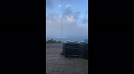 Storm Eunice 100mph wind at Lands End, wildly swaying flag pole!