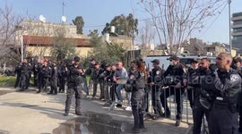 Palestinians and activists take part in a protest in the flashpoint neighbourhood of Sheikh Jarrah in east Jerusalem