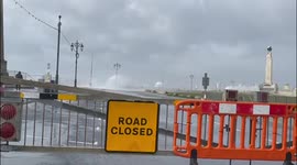 Storm Eunice closes roads in Portsmouth as waves hit the shore and huge spray can be seen in the distance
