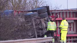 Lorry recovered after Storm Eunis blows it over side of bridge in Kent, UK
