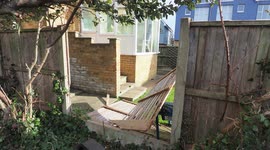 Aftermath of Storm Eunice - property owners left to clear up damage including many fence panels in Kent, UK