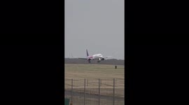Wizz Air plane rocks side to side while landing at London's Stansted Airport in Storm Eunice