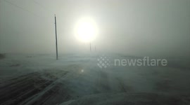 Eerie glow from the sun during intense blizzard in Ontario, Canada