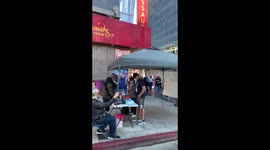 Anti Mask Anti Vax Anti Biden protesters in Hollywood CA gather next to free Covid testing tent.