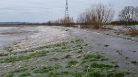 Heavy rain causes River Aire to burst its banks in Castleford, West Yorkshire, UK