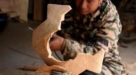 Elderly man carves giant Japanese superhero out of wood for grandson
