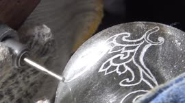 Indonesian who lost job during COVID-19 makes living carving lamps from discarded glass bottles