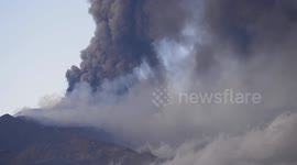 Plumes of volcanic ash ejected from the Etna Volcano during the second major eruption in 2022
