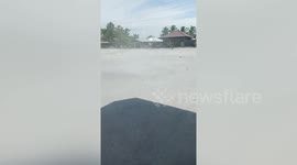 Tuk-tuk drivers ignore strong dust devil tornado on road in the Philippines