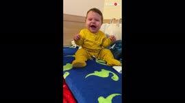 Dramatic baby boy throws tantrum after mom takes away bread