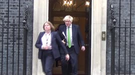 UK PM Boris Johnson leaves 10 Downing Street ahead of announcing sanctions on Russia