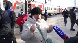 Evacuees from eastern Ukraine give interviews as they arrive in Voronezh, Russia