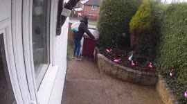 Gust of wind from Storm Eunice hilariously rips bin out of a woman's hand in UK