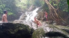 Tourists paddling in rock pool flee as water suddenly gushes down river