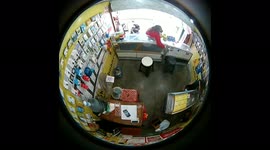 Woman caught on hidden camera stealing a new $147 phone after keeping shopkeepers busy in Indonesia