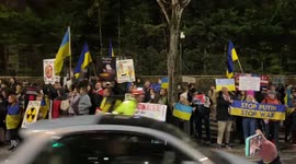 Protesters chant “Putin, hands off Ukraine” outside the Russian Embassy in London