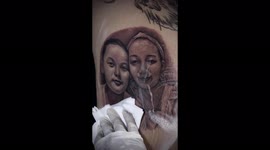 Vietnamese man tattooed image of wife and son on his back to carry them everywhere