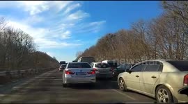 Roads jammed as residents of Ukrainian city try to flee during Russian assault