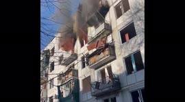Smoke billows from Ukrainian apartment block hit by Russian airstrike