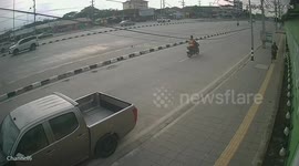 Pedestrian moments from being knocked out by flying wheel in Thailand