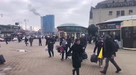 People rush to find shelter after air raid sirens go off in Kyiv