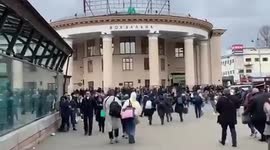 People running into Kyiv subway to take shelter from Russian bombing