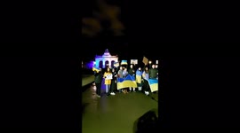 Supporters sing National Ukrainian anthem in Brussels, Belgium