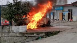 Car bursts into huge flames after child ignites vehicle's hood pad in China