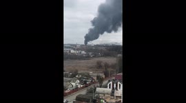 Pillar of smoke and formation of helicopters seen flying over Bucha, central Ukraine