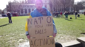 A loner holding a banner written