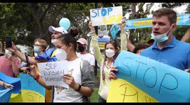 Ukranian residents sing National Anthem in front of the Russian Embassy in Lima, Peru