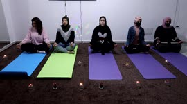 Palestinian female practice yoga during a therapy session at Yoga Hub club.