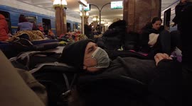 A Foreigner rests at a Bombshelter Metro Station in Kyiv with other Ukrainians at the start of a 2 day curfew until Monday Morning