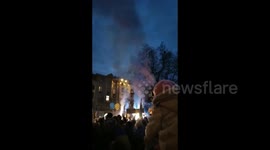 People burn flares during anti-war protest in Poznan, Poland