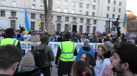 Ukrainians in London sing the Ukrainian national anthem at the end of the solidarity for Ukraine protest outside Downing Street