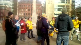 Manchester, UK, 26th February, 2022. Drummers practice before joining a protest or demonstration demanding emergency action to fund the National Health Service.