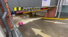 Underground supermarket car park inundated amid deadly floods in Queensland, Australia