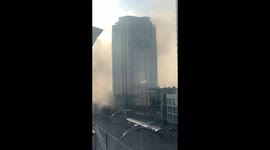 Kyiv apartment block shrouded in smoke after being hit by Russian rocket