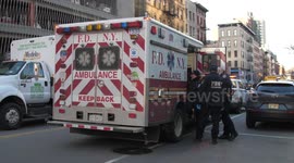 Paramedics carry injured man away from New York subway incident