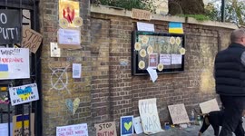 Anti-Putin and pro-Ukraine messages cover the entrance and wall at the Russian Embassy in London