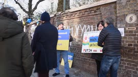 People holding banners outside the Russian embassy in London against the invasion of Ukraine by Russia