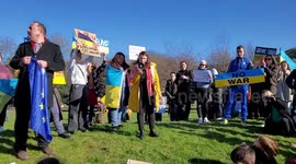 Stand with Ukraine protesters make speeches outside the Scottish Parliament in Edinburgh
