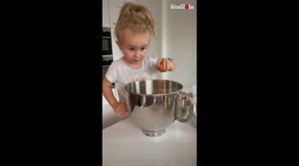'Supremely skilled 4 y/o girl bakes a yummy, rich carrot cake '