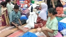 People displaced by Indonesian quake are forced to move again when tents take in water