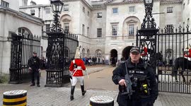 Traditional Soldiers and Modern Police at the Changing of the Guard Ceremony at the Horse Guards Parade, Whitehall, London, UK