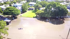 Aerial drone footage shows massive Brisbane, Australia flooding, man kayaking