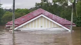 Australia slammed with devastating flooding, panic buying ensues, and double rainbow emerges