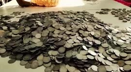 Man in India's Assam state buys a new scooter with heavy bags of coins
